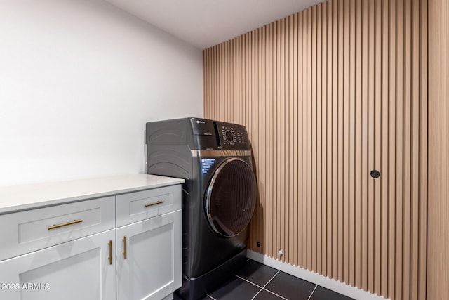 3150 E Beardsley Rd Unit 1081, Phoenix, AZ 85050 - laundry room featuring cabinet space, dark tile patterned flooring, and washer / dryer