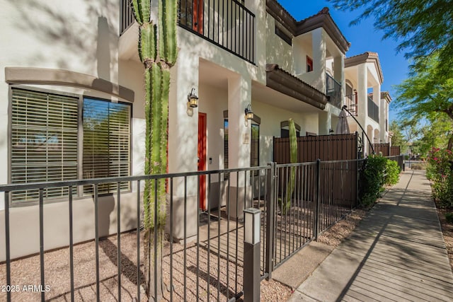 3150 E Beardsley Rd Unit 1081, Phoenix, AZ 85050 - view of side of home featuring stucco siding and a balcony