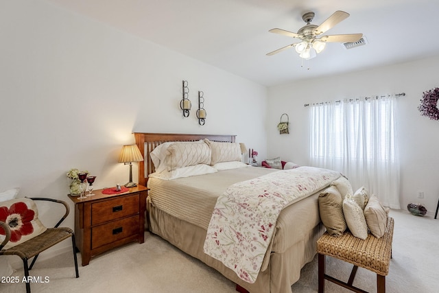 bedroom with light colored carpet and ceiling fan