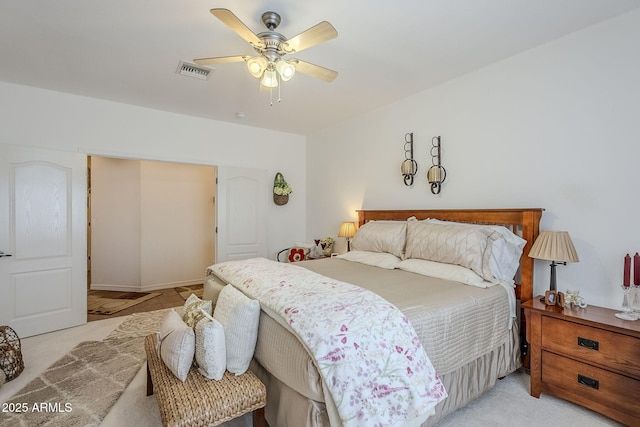 bedroom with light colored carpet and ceiling fan