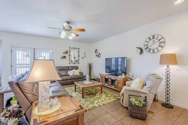 living room with ceiling fan and light tile patterned floors