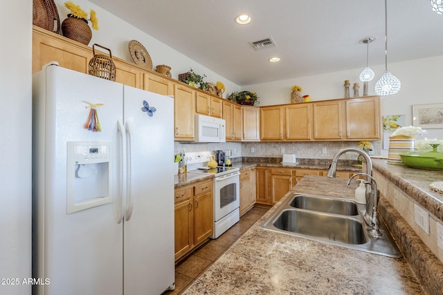 kitchen featuring hanging light fixtures, white appliances, sink, and backsplash