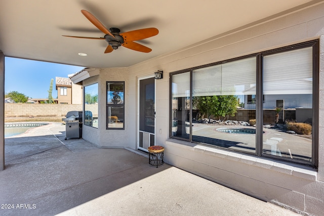 view of patio featuring ceiling fan