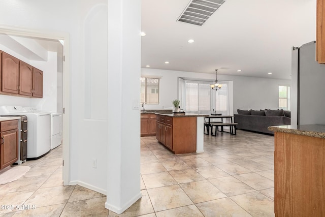 29751 N 119th Ln, Peoria, AZ 85383 - kitchen featuring washing machine and clothes dryer, dark countertops, light tile patterned floors, a chandelier, and recessed lighting