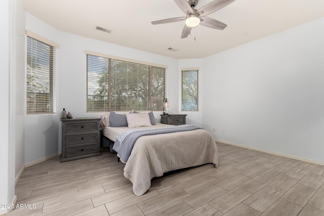 29751 N 119th Ln, Peoria, AZ 85383 - bedroom featuring wood finish floors, ceiling fan, and baseboards