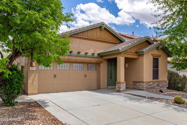 29751 N 119th Ln, Peoria, AZ 85383 - view of front of home with an attached garage, driveway, a tile roof, stucco siding, and stone siding