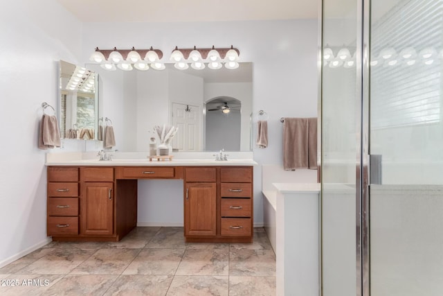 29751 N 119th Ln, Peoria, AZ 85383 - bathroom with double vanity, a stall shower, and baseboards