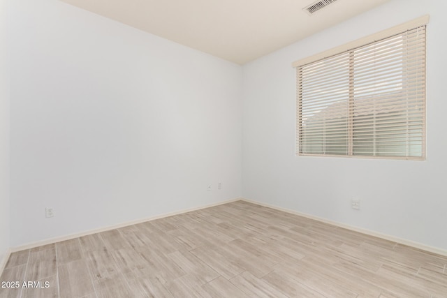29751 N 119th Ln, Peoria, AZ 85383 - empty room featuring wood finished floors and baseboards