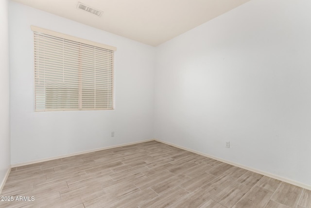 29751 N 119th Ln, Peoria, AZ 85383 - unfurnished room with light wood-style flooring and baseboards