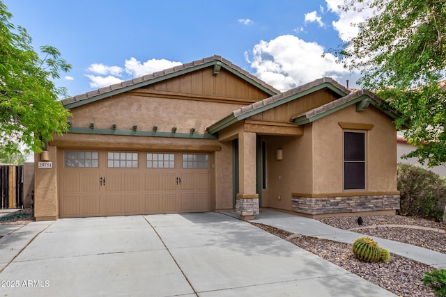 29751 N 119th Ln, Peoria, AZ 85383 - view of front of property with concrete driveway, an attached garage, stucco siding, and stone siding