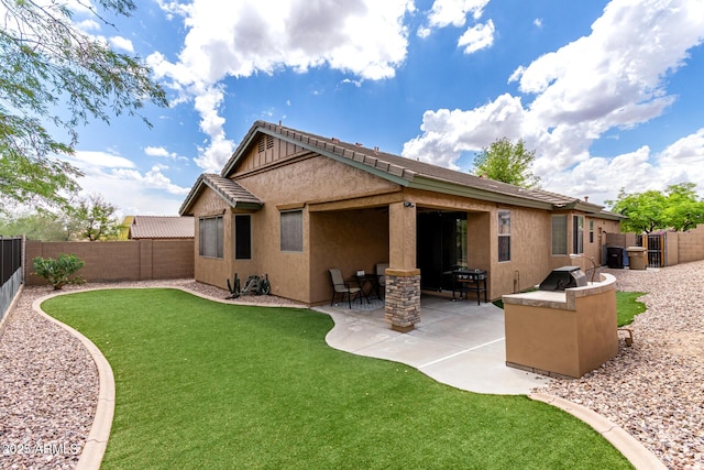 29751 N 119th Ln, Peoria, AZ 85383 - rear view of house featuring stucco siding and a patio area