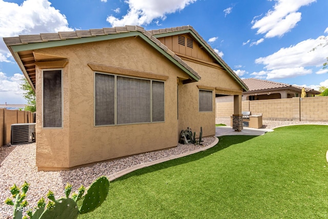 29751 N 119th Ln, Peoria, AZ 85383 - back of house featuring cooling unit, stucco siding, a patio, and a tiled roof