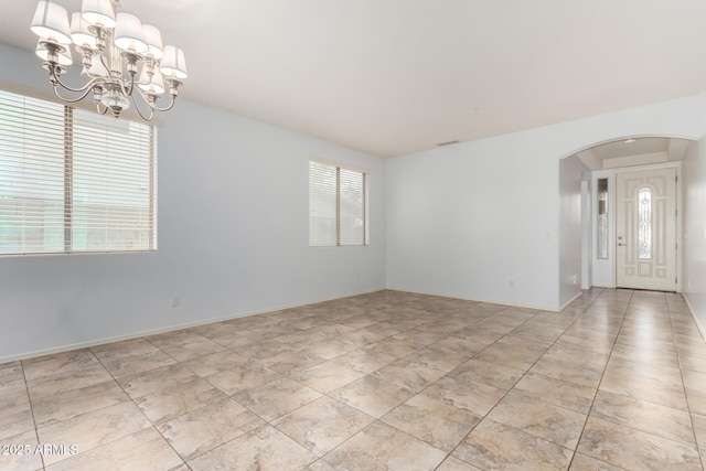 29751 N 119th Ln, Peoria, AZ 85383 - spare room with arched walkways and a chandelier