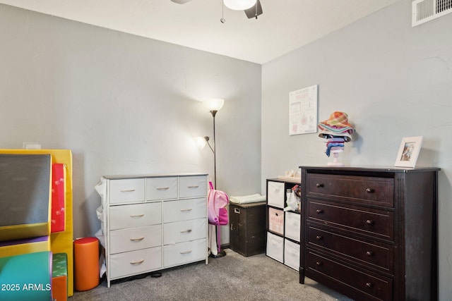 recreation room with light colored carpet and ceiling fan