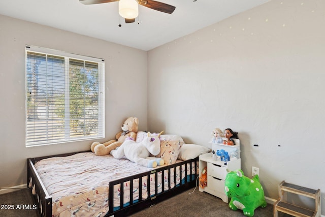 bedroom with dark carpet and ceiling fan