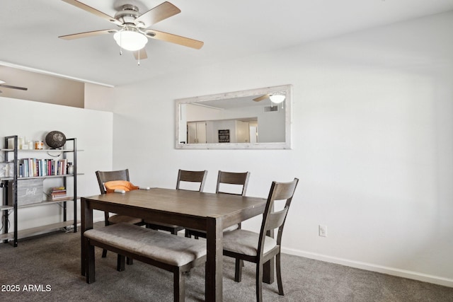 carpeted dining space featuring ceiling fan