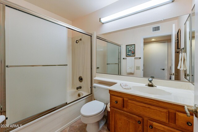 laundry area featuring cabinets, a textured ceiling, light tile patterned floors, and washer and dryer