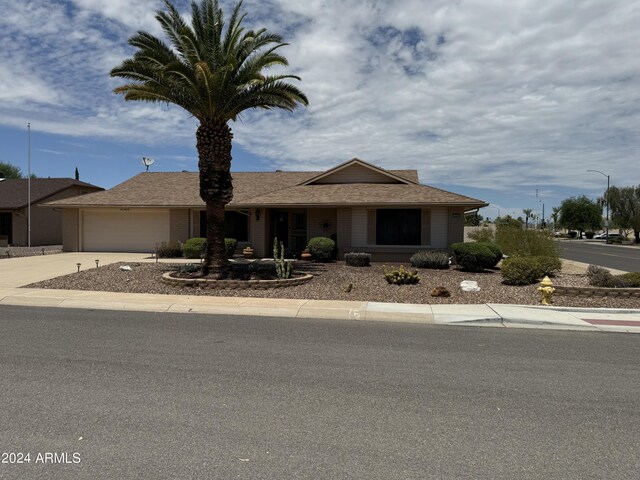 rear view of property with a sunroom and a patio