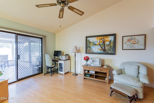 home office featuring ceiling fan, lofted ceiling, and light hardwood / wood-style floors