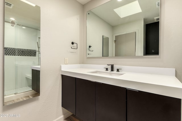 8540 N Central Ave Unit 6, Phoenix, AZ 85020 - full bathroom featuring a skylight, a stall shower, and vanity