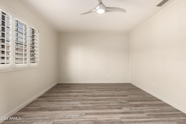 8540 N Central Ave Unit 6, Phoenix, AZ 85020 - empty room with a ceiling fan and wood finished floors