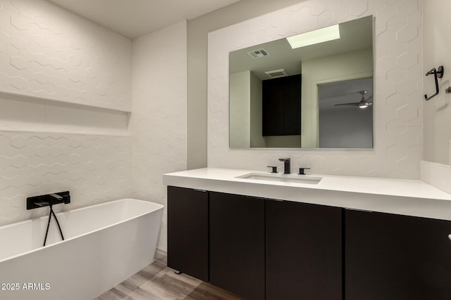 8540 N Central Ave Unit 6, Phoenix, AZ 85020 - bathroom with a soaking tub, wood finished floors, and vanity