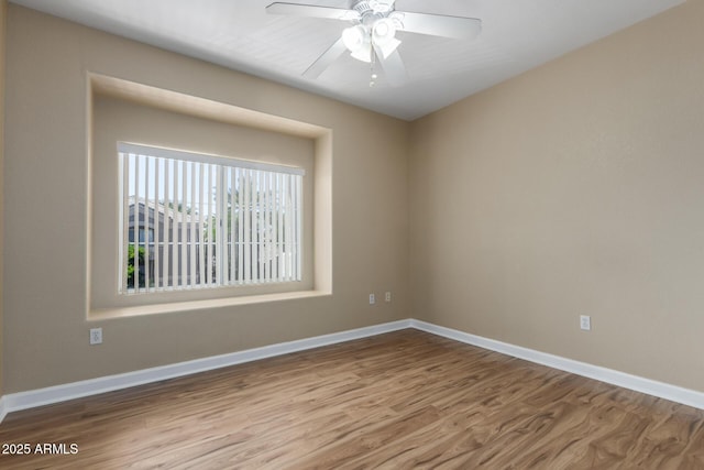4465 E Paradise Village Pkwy S Unit 1224, Phoenix, AZ 85032 - spare room with wood finished floors, baseboards, and ceiling fan