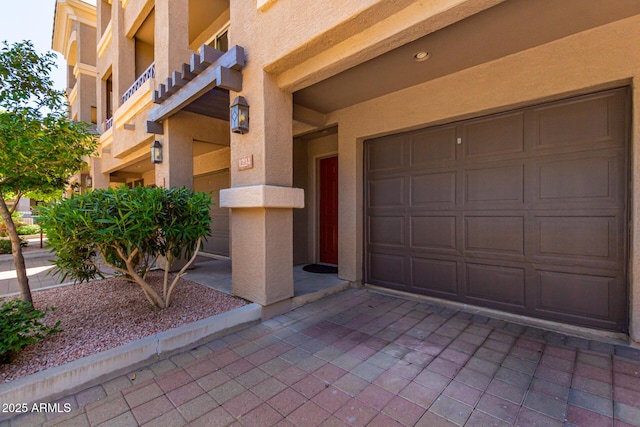 4465 E Paradise Village Pkwy S Unit 1224, Phoenix, AZ 85032 - doorway to property featuring stucco siding and driveway