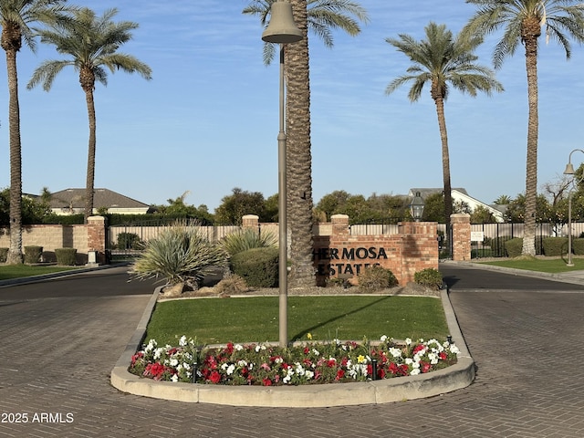community sign featuring fence
