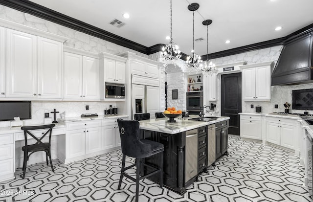 kitchen with white cabinetry, visible vents, built in appliances, and crown molding