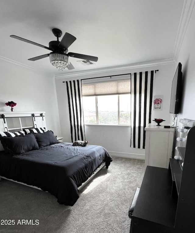 carpeted bedroom featuring ceiling fan, visible vents, and crown molding