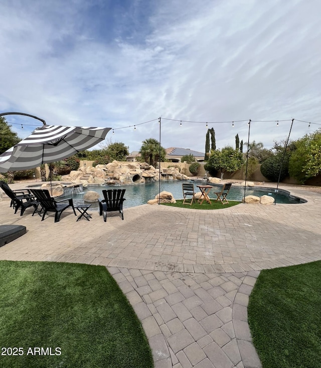 view of home's community with a patio area and a pool