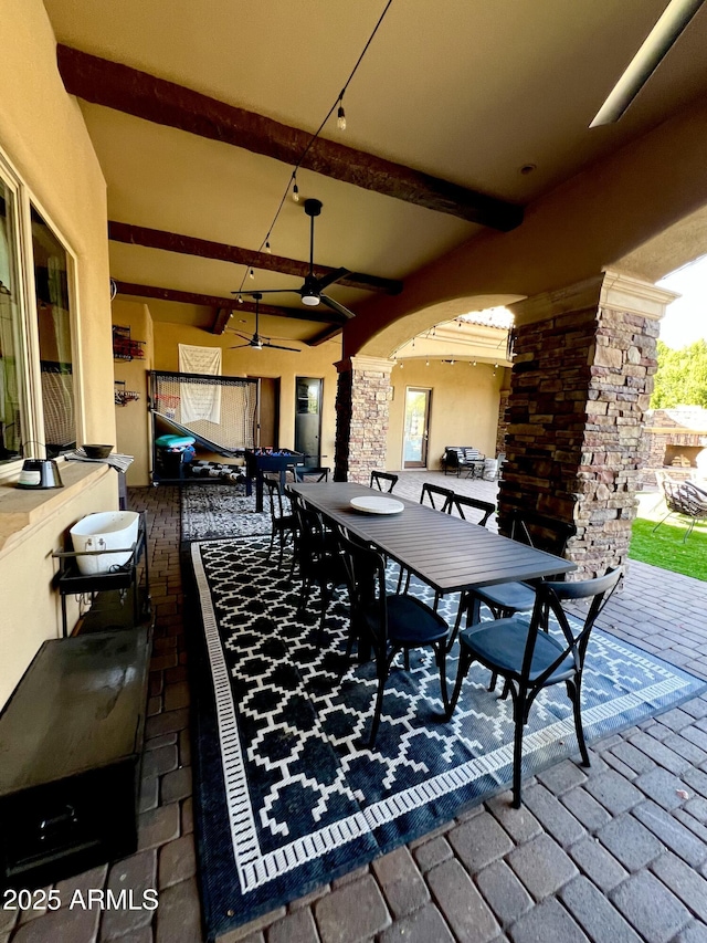 view of patio / terrace featuring outdoor dining area and ceiling fan