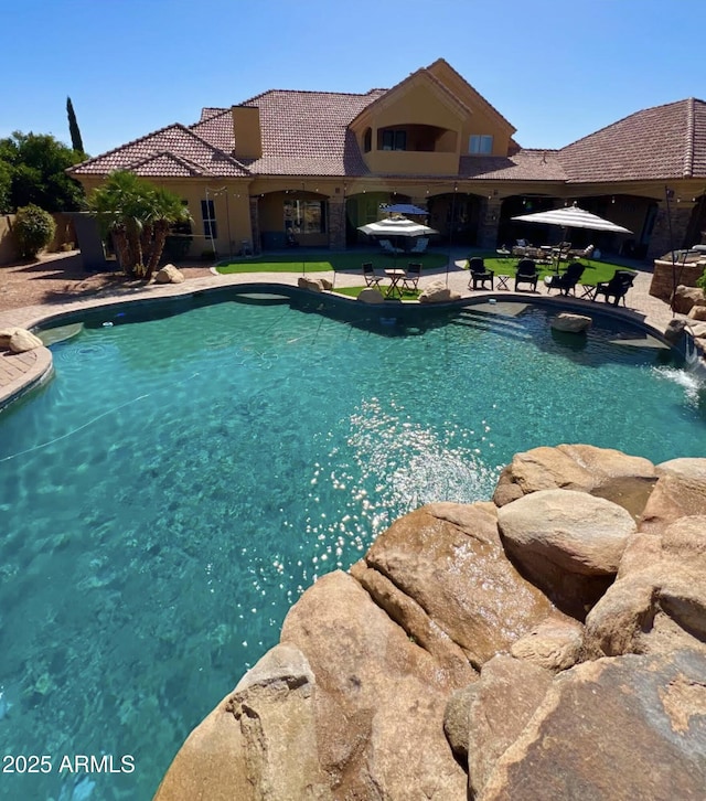 outdoor pool featuring a patio