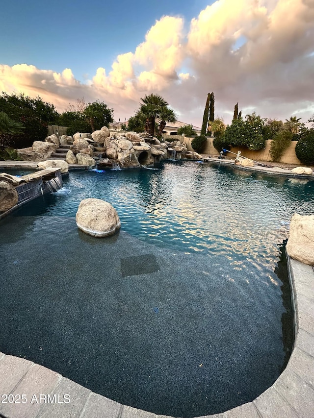 view of swimming pool featuring a pool with connected hot tub