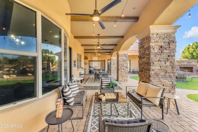 view of patio with an outdoor living space and ceiling fan