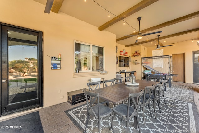 view of patio with a ceiling fan and outdoor dining area
