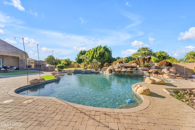 pool featuring a patio area