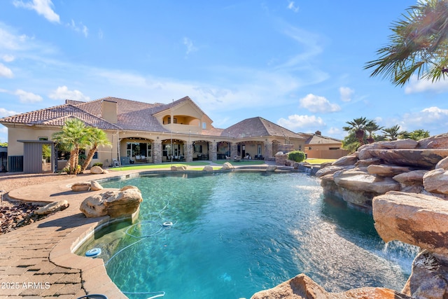 pool featuring a patio area