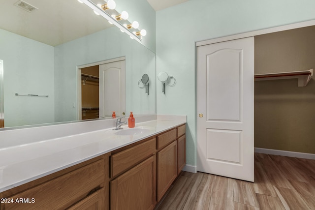 bathroom with wood-type flooring and vanity