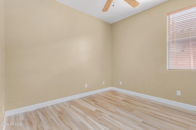 unfurnished room with ceiling fan and light hardwood / wood-style floors