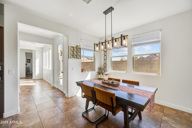 tiled dining area with a healthy amount of sunlight