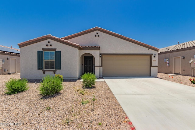 25539 W Gwen St, Buckeye, AZ 85326 - mediterranean / spanish-style home featuring stucco siding, a garage, a tiled roof, and driveway