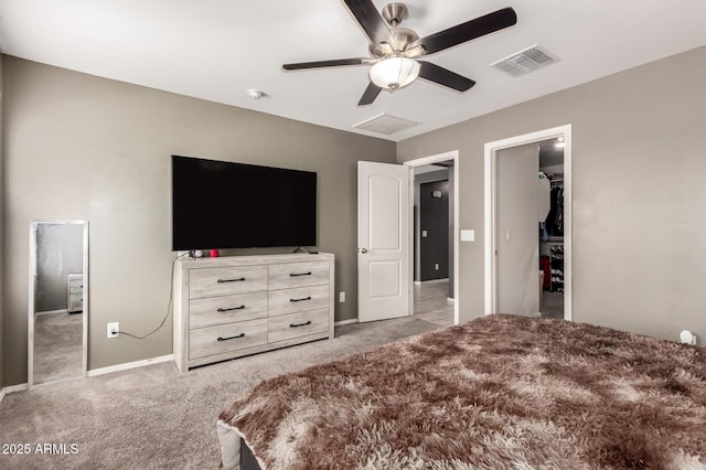 25539 W Gwen St, Buckeye, AZ 85326 - bedroom featuring light colored carpet, baseboards, ceiling fan, and a walk in closet