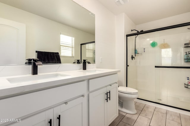 25539 W Gwen St, Buckeye, AZ 85326 - bathroom featuring toilet, a stall shower, and double vanity