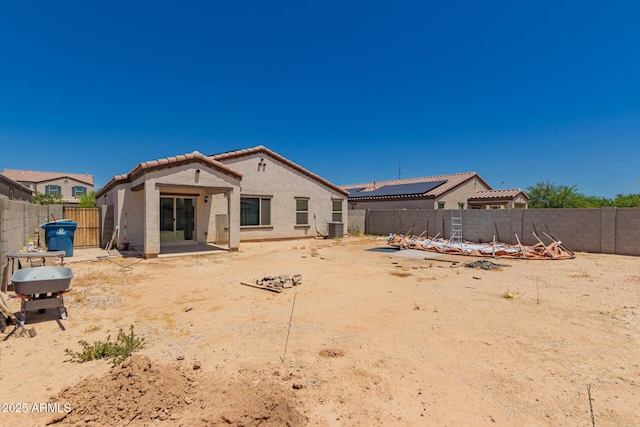 25539 W Gwen St, Buckeye, AZ 85326 - back of house with a tiled roof, stucco siding, a fenced backyard, and central AC