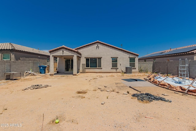 25539 W Gwen St, Buckeye, AZ 85326 - rear view of house with a fenced backyard, stucco siding, a tile roof, and central air condition unit