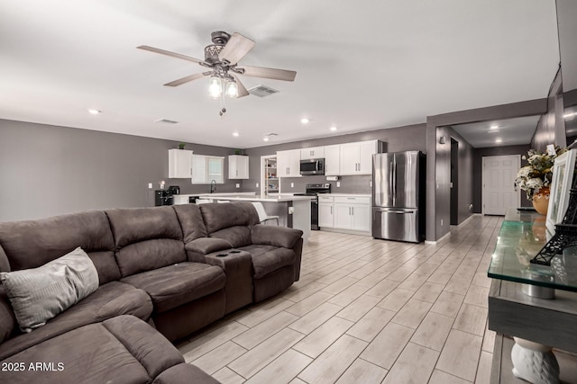 25539 W Gwen St, Buckeye, AZ 85326 - living area featuring ceiling fan, recessed lighting, and light wood-type flooring
