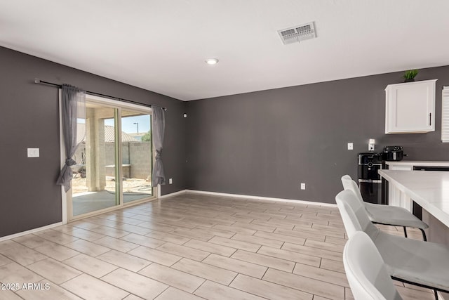 25539 W Gwen St, Buckeye, AZ 85326 - kitchen featuring light countertops, white cabinets, and baseboards