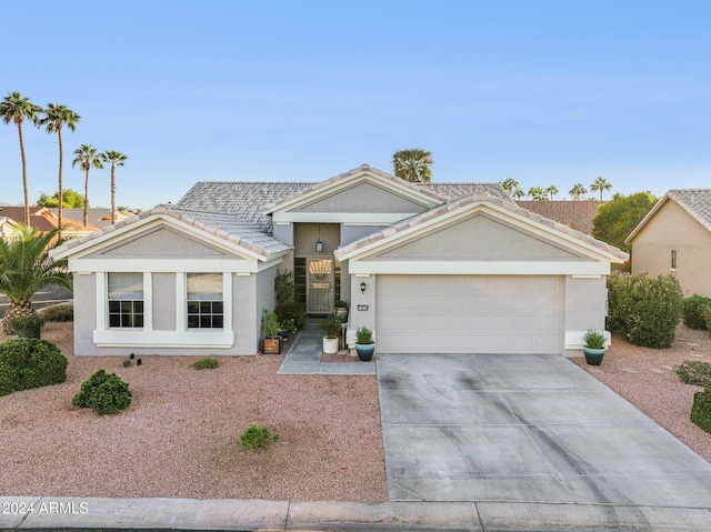 ranch-style house featuring a garage